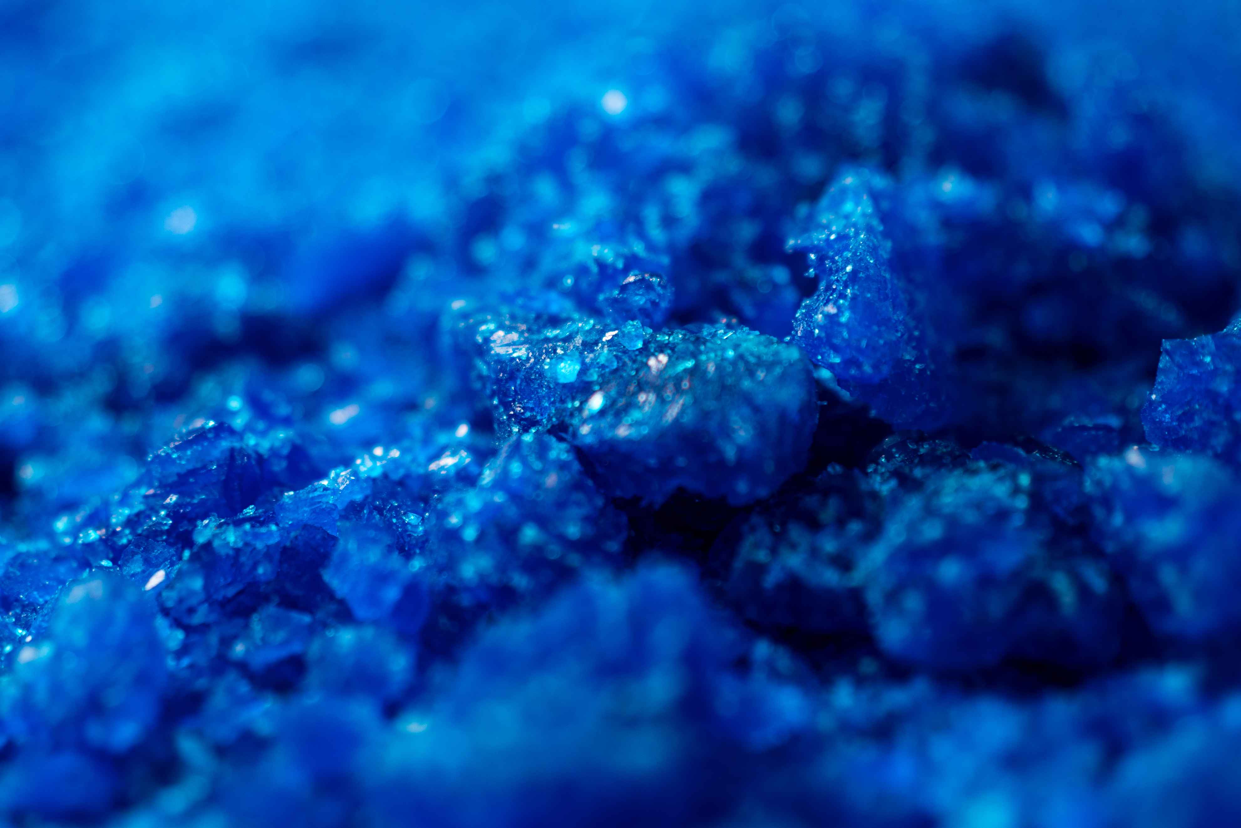 Close macro photograph of blue copper sulphate crystals for Eva Chemlinks.