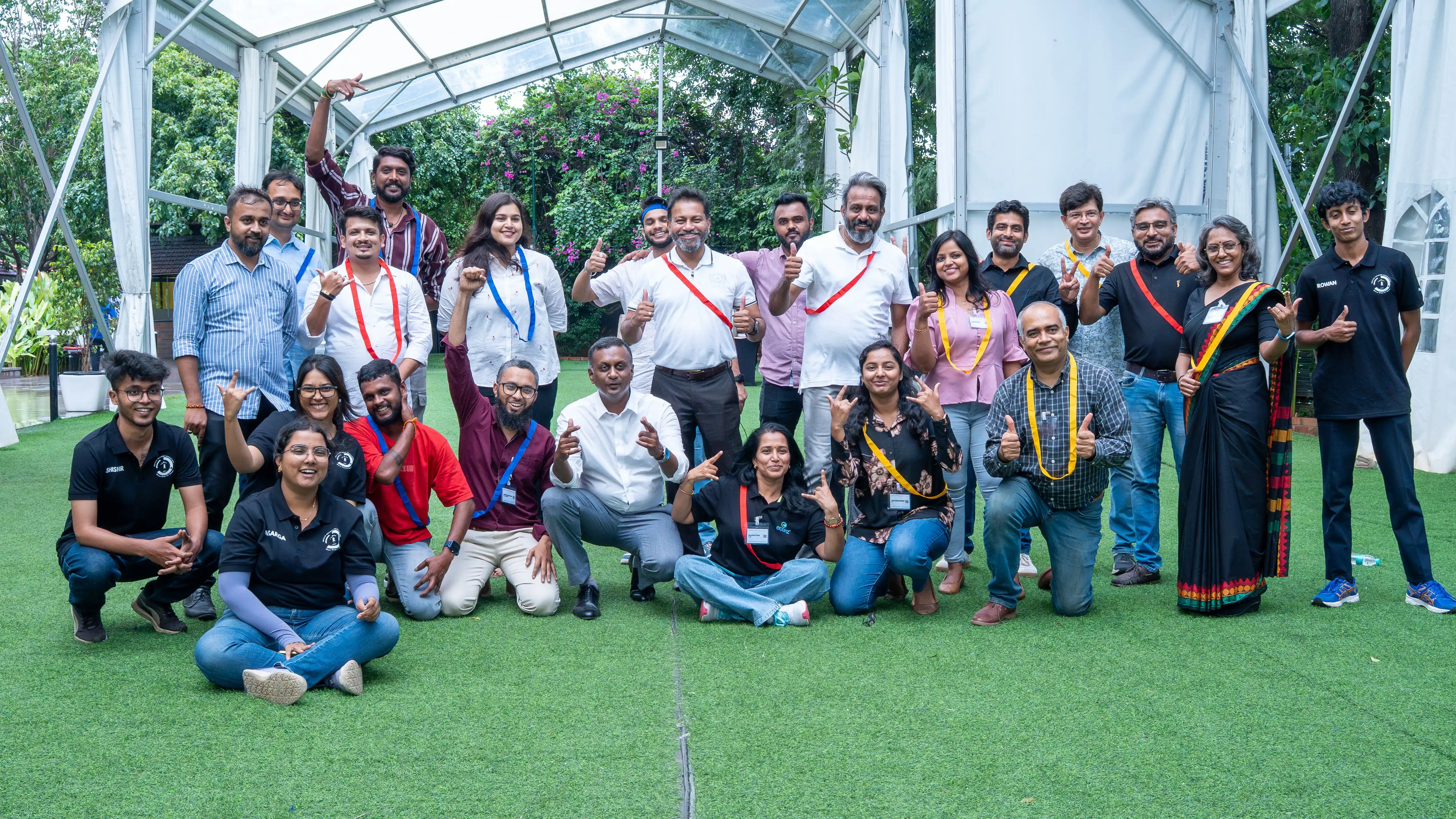 Event participants pose together outdoors for Skill Beyond Education.